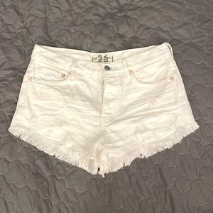 White Free People low waisted jean shorts, size 26.